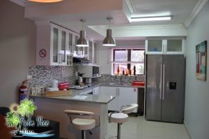 Fully equipped kitchen in the self-catering unit with sleek countertops