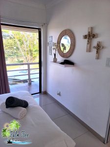 Decorative wall hangings beside the main bed